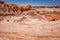 Fire wave with swirly layers of deposited sandstone during wonderful sunny day with blue sky, in Valley of Fire State Park