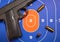 Firearm and Bullets on Practice Gun Target