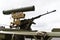 Firearms on the roof of a military vehicle. Machine gun and grenade launcher for warfare. Close-up