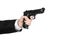 Firearms and security topic: a man in a black suit holding a gun on an isolated white background in studio