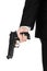 Firearms and security topic: a man in a black suit holding a gun on an isolated white background in studio