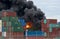 Fireball explosion at a West Footscray factory fire as seen from behind shipping containers. Melbourne, Victoria, Australia 30 Aug