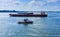 Fireboat and Freighters in New York Harbor