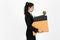 Fired dismissal young Asian business woman in suit holding box with personal belongings on white  background. Unemployment