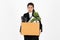 Fired dismissal young Asian business woman in suit holding box with personal belongings on white isolated background. Unemployment