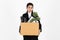 Fired dismissal young Asian business woman in suit holding box with personal belongings on white isolated background. Unemployment