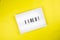Fired! message on lightbox on yellow background isolated flat lay