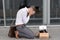 The fired office worker fell to his knees and covered his face due to stress.