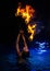 Firedancer woman in water