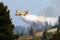 Firefghter water bomber airplane dumping its load