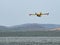 Firefighter airplane, water bomber, air tank taking water from t