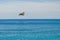 A firefighter canadair in flight during a sea exercise