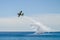 A firefighter canadair in flight during a sea exercise