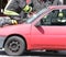 Firefighter cuts the windshield of car with a special Hacksaw