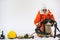 Firefighter demonstrates wearing uniforms helmets and various equipment to prepare firefighters on a white background