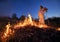 Firefighter ecologist working in field with wildfire.