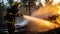 Firefighter fighting a fire in the forest at sunset. Firefighter in action