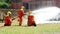 Firefighter fighting with flame using fire hose chemical water foam spray engine. Fireman wear hard hat, body safe suit uniform fo