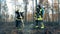 Firefighter, fireman, forest fire concept. Two firemen are finishing to handle a forest after the fire