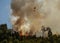 Firefighter Helicopter fighting against a Forest Fire during Day in Povoa de Lanhoso.