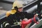 Firefighter holds a fire suppression system hydrant on a hospital helipad during a cold cloudy winter day