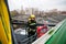 Firefighter holds a fire suppression system hydrant on a hospital helipad during a cold cloudy winter day