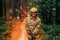 Firefighter at job. Firefighter in dangerous forest areas surrounded by strong fire. Concept of the work of the fire