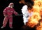 Firefighter with mask and fully protective suit on fire backgrou