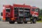 A firefighter meticulously prepares a modern firetruck for a mission to evacuate and respond to dangerous situations