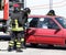 Firefighter opens car door with pneumatic shears after the road