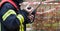 Firefighter operate with a walkie talkie in action - Serie Firefighter