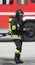 Firefighter with oxygen cylinder and black boots during an emerg