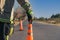 Firefighter putting cone on road