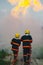 Firefighter spraying high pressure water to fire