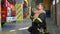 Firefighter in uniform hugs a little boy near a fire engine at station