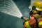Firefighter water spray by high pressure fire hose