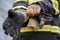 Firefighter wearing glove at fire station ready to rescue