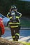 Firefighter at work with protective gear at day