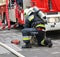 Firefighter works next to a firetruck