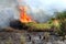 Firefighters attempt to extinguish for a big fire in summertime