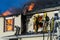 Firefighters battle blazing house fire