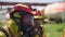 Firefighters. Clip. Two masked men who conduct exercises with a hose and water with special equipment and in a special