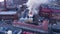 Firefighters extinguish a burning building, aerial view