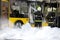 Firefighters extinguish burning bus with foam