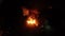 Firefighters extinguish burning cars at night