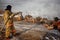 Firefighters extinguish a fire on the roof of a house on a frosty winter day