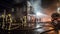 Firefighters fighting a fire in a burning building at night. Firefighters fighting a fire.