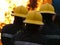 Firefighters fighting industrial fire, firefighting team