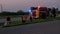 Firefighters responding to fire on road. Firefighters near a firetruck with flashing lights during a road side fire in San Antonio