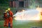 Firefighters spraying water to put out a brutal fire on the truck.